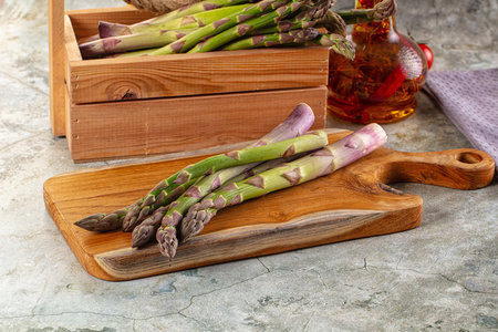 Fresh green asparagus sprouts heap for cookingの写真素材