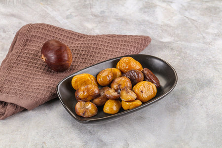 Roasted sweet natural organic shestnut in the bowlの写真素材