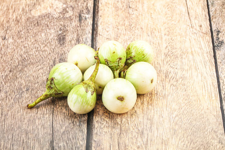 Small organic young green round eggplant heapの写真素材