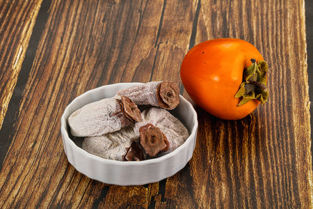 Dry sweet ripe persimon fruit dessertの写真素材