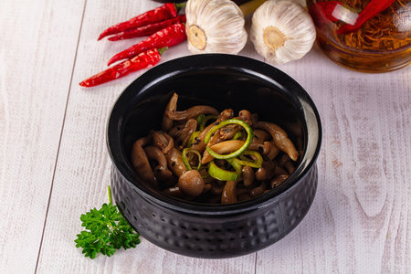 Asian cuisine roasted enoki mushrooms with oilの写真素材