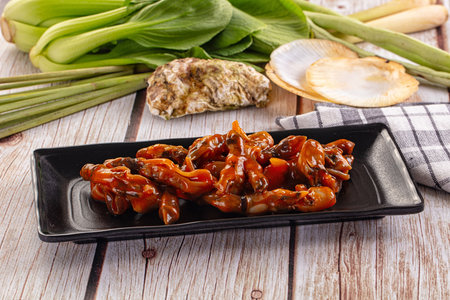 Razor shell clam with spicy sauceの写真素材