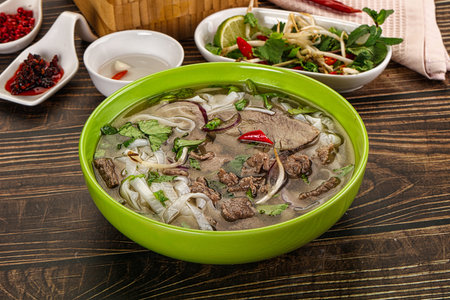 Vietnamese Pho Bo soup with beef, noodles, cilantro and spices