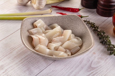 Raw squid rings for cooking in the plateの写真素材