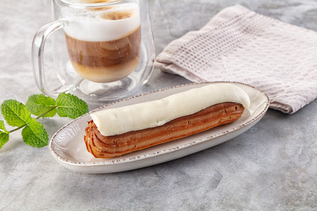 White delicous vanilla eclair with icing dessert