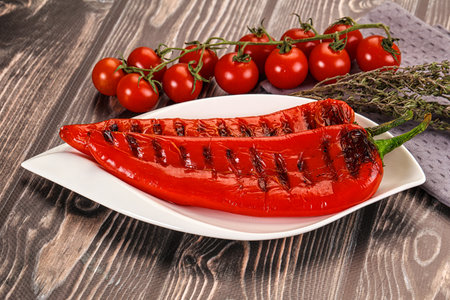 Grilled whole red paprika ramiro pepperの写真素材