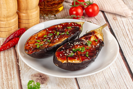 Baked eggplant with teriyaki sause and sesame seedsの写真素材