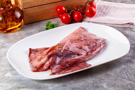 Raw fresh calamari for cooking over board