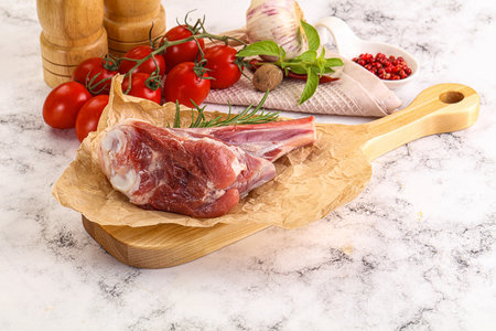 Raw lamb shank for cooking over boardの写真素材