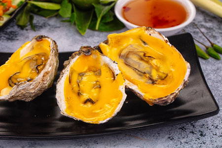 Baked hot oyster with cheddar cheeseの写真素材