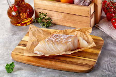 Raw cod fish fillet for cooking over board