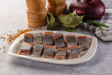 Salted herring fillet pies snack with oil