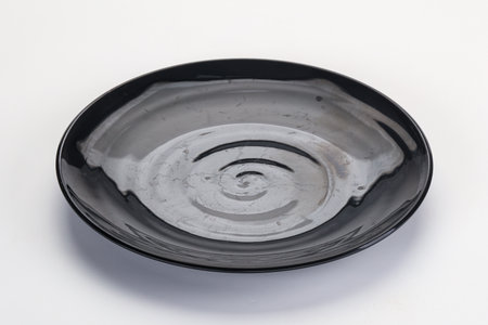 Empty clean color plate dishware isolatedの写真素材