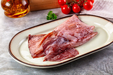 Raw fresh calamari for cooking over board