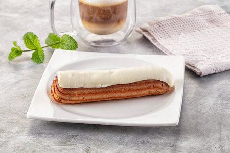 White delicous vanilla eclair with icing dessert