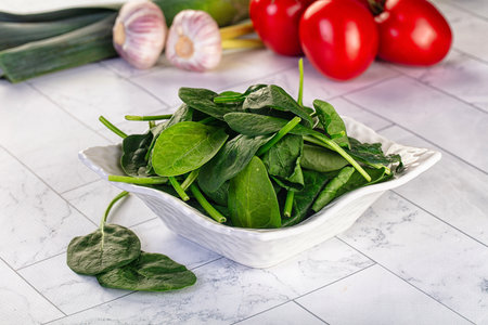 Raw fresh green spinach leaves in the bowl
