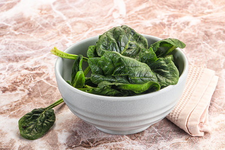 Fresh green spinach leaves heap in the bowl