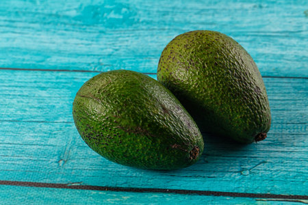 Raw ripe green juicy avocado tropical fruit