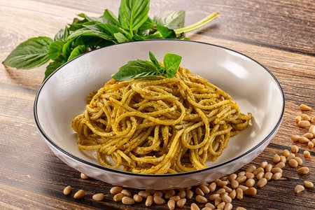 Italian green pasta with pesto sauce and basil leavesの写真素材