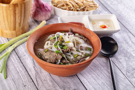 Vietnamese Pho Bo soup with beef and noodles