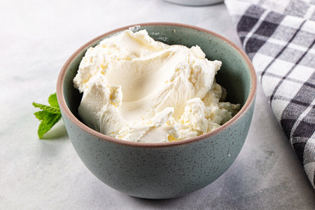 Cream cheese in the bowl served mint
