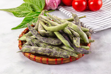 Raw green bean strips heap in the bowl