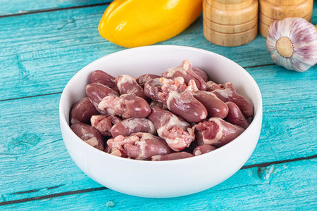 Raw chicken hearts for cooking in the bowl