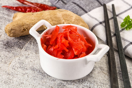 Marinated spicy ginger root in the bowlの写真素材