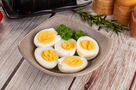 Boiled eggs half with bright yolk