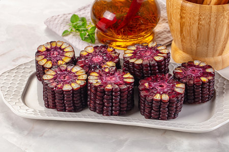 Ripe boiled black corn maize garnishの写真素材