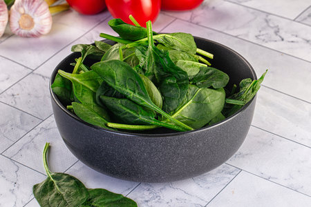 Raw fresh green spinach leaves in the bowl