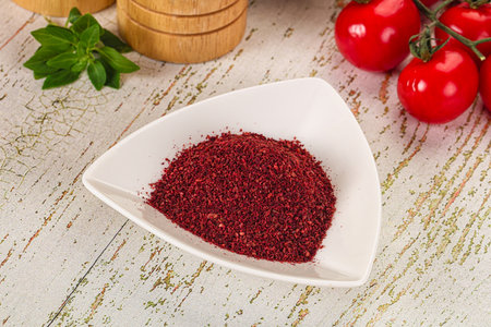 Natural organic Sumah powder for culinary in the bowl