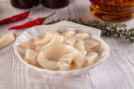 Raw squid rings for cooking in the plate