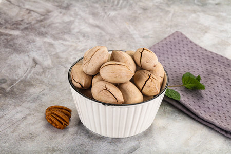 Crunchy pecan nut snack in the bowl
