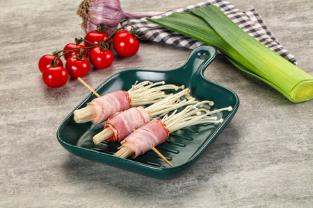 Raw roll with enoki mushroom and baconの写真素材