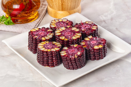 Ripe boiled black corn maize garnishの写真素材