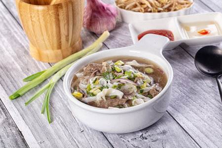 Vietnamese Pho Bo soup with beef and noodles