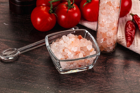 Rose pink Himalai salt in the bowl for cooking or spaの写真素材