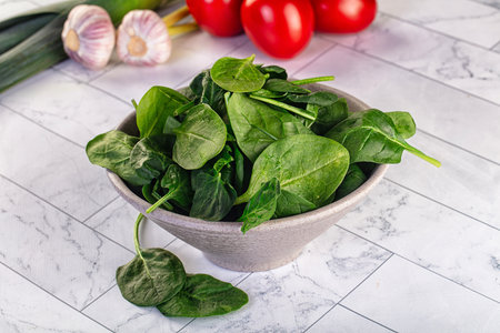 Raw fresh green spinach leaves in the bowl
