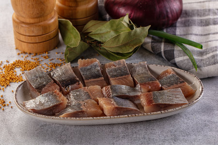 Salted herring fillet pies snack with oilの写真素材