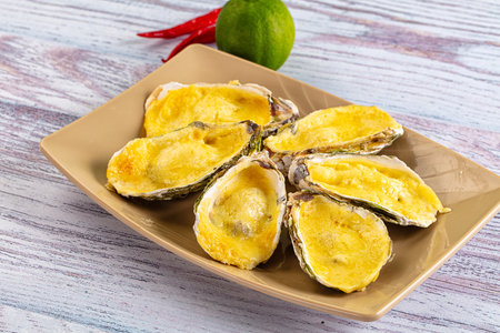 Plate of Baked oyster with parmesan cheese