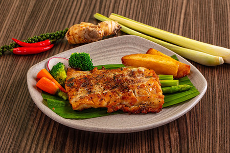 Gourmet asian Grilled crocodile steak served potato and asparagus
