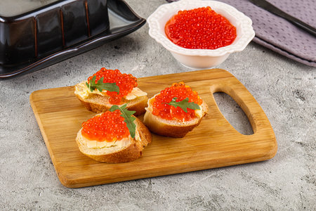 Luxury toast with red caviar and butterの写真素材