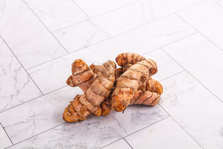 Fresh raw asian tumeric roots heapの写真素材