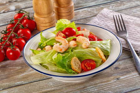 Caesar salad with prawn, tomato and romanoの写真素材