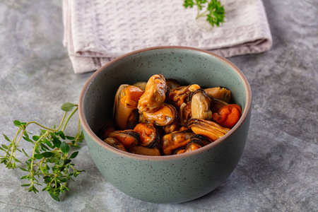 Peeled marinated mussels heap in the bowlの写真素材
