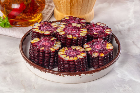 Ripe boiled black corn maize garnishの写真素材