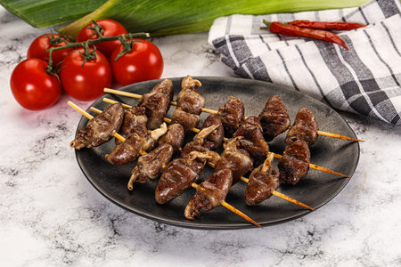 Gourmet Grilled chicken hearts skewer in the plate