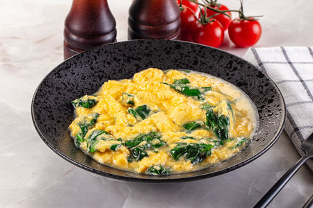 Tasty Omelette with spinach for breakfastの写真素材