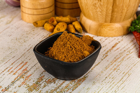 Indian cuisine - curry powder for culinary in the bowlの写真素材